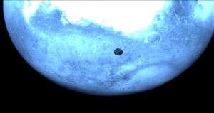 European probe swings past Mars, snaps stunning photos of elusive moon Deimos during asteroid mission