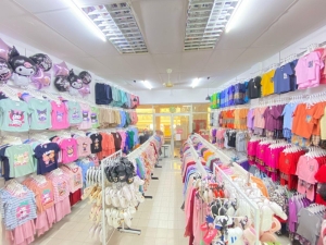 ‘Accessible to everyone’: Husband-wife team keeps Raya special for kids with low-cost clothing in Kuching