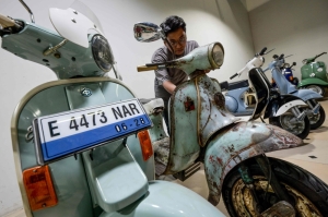 Jakarta firm converts vintage Vespas into electric scooters to tackle pollution, preserve nostalgia