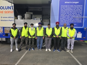 Hope in a curry box: Sikh volunteers drive 1,200km to feed flood-hit Australians